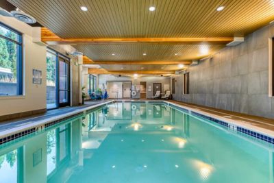 Enjoy the indoor swimming pool at MorningStar Senior Living Hillsboro, where clear water, large windows, and cozy poolside chairs create a relaxing atmosphere perfect for retirement living.