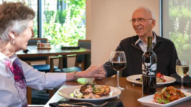 A senior couple enjoying a nice dinner together